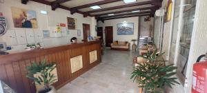 a lobby of a salon with a waiting room at Apartamentos Turisticos Praia Grande in Ferragudo