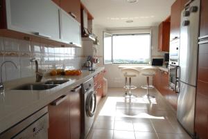 Kuchyň nebo kuchyňský kout v ubytování Penthouse /View/Sea/Quiet/Golf/Pool/Atalaya