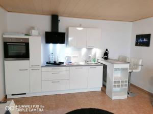 Η κουζίνα ή μικρή κουζίνα στο Haus Jäger Ruheoase im Grünen +12 φωτογραφίες