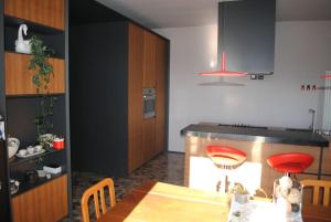 a kitchen with a table and a dining room at La Casa in Relax in Guardia Vomano
