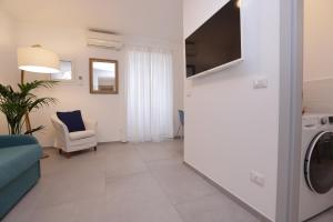 TV o dispositivi per l'intrattenimento presso Adamaina - Sea view apartment with private garage