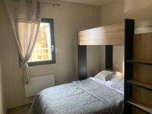 Posteľ alebo postele v izbe v ubytovaní Charmant appartement