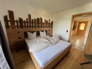 Uma cama ou camas num quarto em Studlerhof