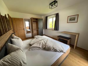 Uma cama ou camas num quarto em Studlerhof