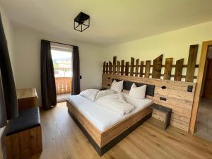 Uma cama ou camas num quarto em Studlerhof