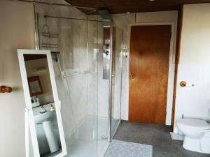 a bathroom with a shower and a toilet at Large 4 double bed house 20 mins from Bath City in Bristol