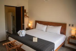 Postel nebo postele na pokoji v ubytování Hotel Muyu Tulum
