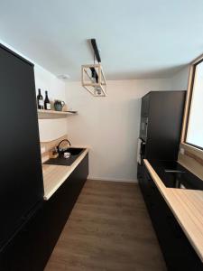 Kuchyňa alebo kuchynka v ubytovaní APPARTEMENT AUX PIEDS DES PISTES DE SKI + 11 fotografií