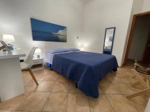 Postel nebo postele na pokoji v ubytování B&B Scala dei Turchi Beach