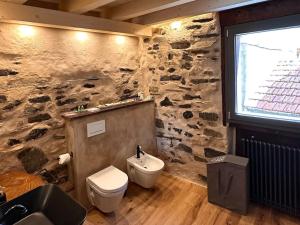 Koupelna v ubytování Romantic home stone with amazing view lake of Como and Oleandra
