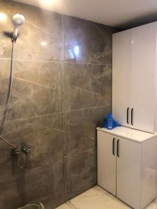 a bathroom with a shower stall with a shower at Very nice view from the city in Nevşehir