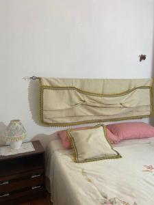 En eller flere senge i et værelse på Su Murcone Appartamento Baunei