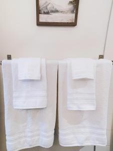 two towels hanging on a towel rack in a bathroom at 2BR condo in downtown, w/ view+parking in Calgary