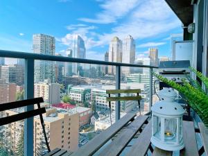 a balcony with a view of a city at 2BR condo in downtown, w/ view+parking in Calgary