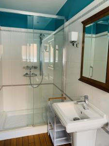 a bathroom with a shower and a sink and a tub at La Maison d'Emilie - Chambres d'hôtes in Chaumes-en-Brie