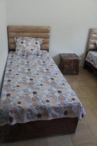 a bedroom with a bed with a blanket on it at Relaxing Vacation Stay in Mahdia in Rejiche
