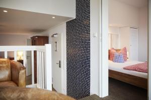 Postel nebo postele na pokoji v ubytování Bernstein-Hotel Bootshaus