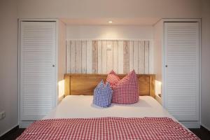 Postel nebo postele na pokoji v ubytování Bernstein-Hotel Bootshaus
