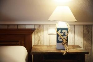 Postel nebo postele na pokoji v ubytování Bernstein-Hotel Bootshaus