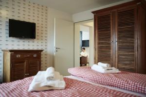 Postel nebo postele na pokoji v ubytování Bernstein-Hotel Bootshaus