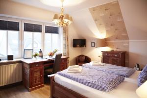 Postel nebo postele na pokoji v ubytování Bernstein-Hotel Bootshaus