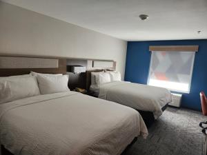 a hotel room with two beds and a window at Holiday Inn Express & Suites Perry, an IHG Hotel in Perry