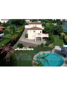 a view of a house and a swimming pool at Villa Hibiscus in Antibes