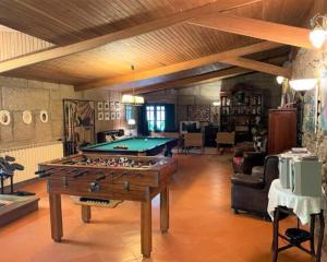 a living room with a pool table in it at Casa da Pedra - Turismo Rural in Bragado