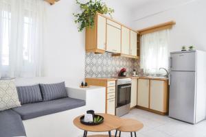 Kuchyň nebo kuchyňský kout v ubytování Niki Rooms + 30 fotografií