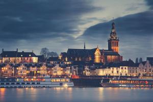 a large city with a clock tower and a building at B&B Noviomagus in Nijmegen