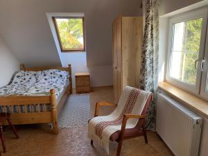 Posteľ alebo postele v izbe v ubytovaní Apartament na poddaszu