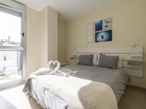 Posteľ alebo postele v izbe v ubytovaní Nuevos Lightbooking Livian Suites Las Palmas