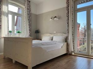 a bedroom with a bed and a window at Ölmühle Eberstedt in Eberstedt