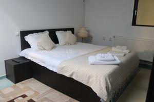 מיטה או מיטות בחדר ב-Casa Dobra