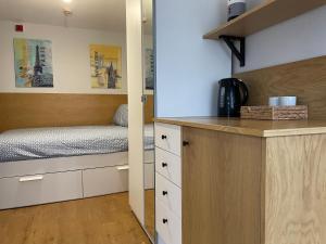 a small bedroom with a bed and a counter at 228 Cinderhill Road in Nottingham