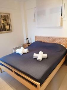 two pillows on a bed in a bedroom at Breathtaking sea view in Kavala