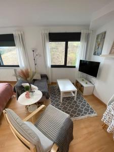 Televízia a/alebo spoločenská miestnosť v ubytovaní Estudio en Solares, Cantabria + 3 fotografie