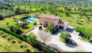 an aerial view of a house with a swimming pool at Finca Cari in Can Picafort