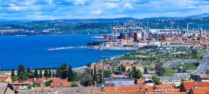 a view of a city with a harbor and the water at Vista Capodistria in Koper