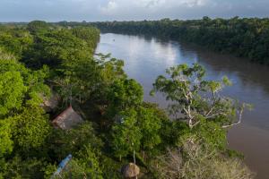 an aerial view of a river with trees at Las Guacamayas Lodge Resort, Selva Lacandona, Chiapas México in Tlatizapán