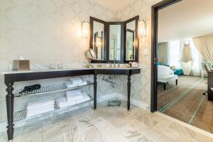 a bathroom with a sink and a mirror at The Nines, a Luxury Collection Hotel, Portland in Portland