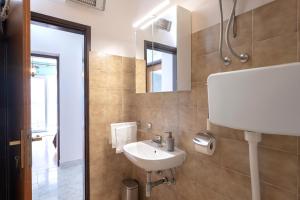 a bathroom with a sink and a mirror at Apartments Bodlović in Hvar