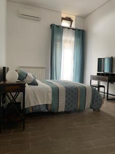 Postel nebo postele na pokoji v ubytování Maison Mercurio Baia Bacoli