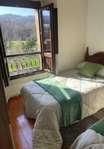 Postelja oz. postelje v sobi nastanitve Pantin Corao Casa Rural
