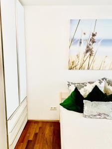 a white couch in a room with a large window at Stadt Villa Rastatt in Rastatt