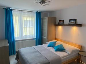 Postel nebo postele na pokoji v ubytování DAWIDEK