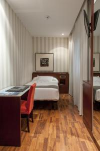 Кровать или кровати в номере Zenit Murcia