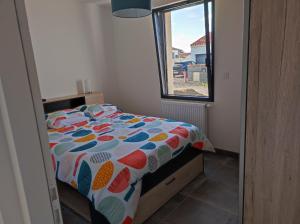 En eller flere senge i et værelse på maison angles