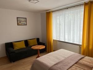Postel nebo postele na pokoji v ubytování DAWIDEK