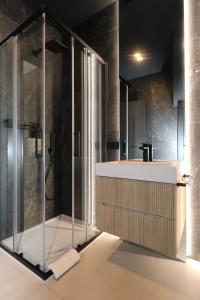 a bathroom with a shower and a sink at Hidden GEM-Renovated 2023-Studio Garibaldi-perfect for Romantic couples-Best of the Best in Olbia